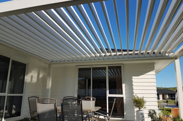 Freestanding Bask Louvre Roof fitted on North Facing Patio opened up to let the winter sun in